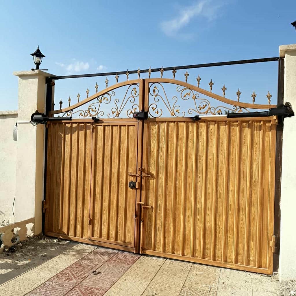 تعمیر جک بازویی درب پارکینگ و تنظیم حرکت
